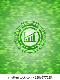 growth chart icon inside realistic green mosaic emblem
