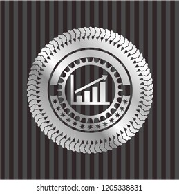 growth chart icon inside silvery badge