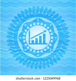 growth chart icon inside water wave representation badge background.
