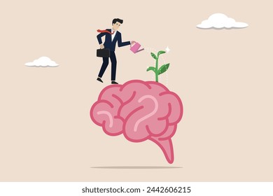 Growth mindset positive attitude to learn new thing, brain motivation, learning concept, businessman watering growth seedling on his brain.
