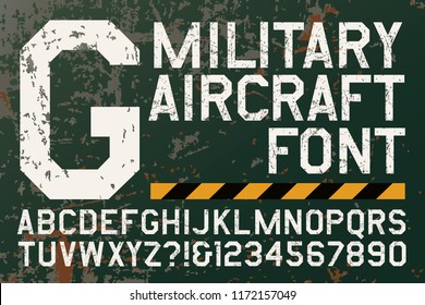 A grunge alphabet in the style of military aircraft insignias and markings. This geometric font has a chipped metal paint appearance. 