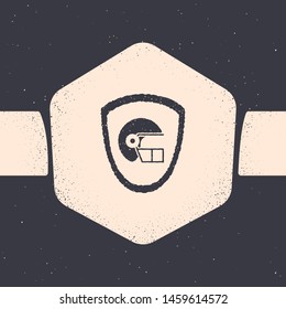 Grunge American football helmet and shield icon isolated on grey background. Monochrome vintage drawing. Vector Illustration