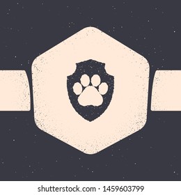 Grunge Animal health insurance icon isolated on grey background. Pet protection icon. Dog or cat paw print. Monochrome vintage drawing. Vector Illustration