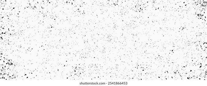 Grunge background with a white background and black speckles. The background has a textured, distressed style. White and black contrast prominently. Minimal grainy speckled texture background vector