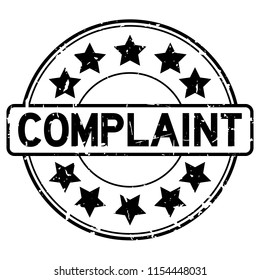 Grunge black complaint word with star icon round rubber seal stamp on white background