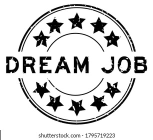 Grunge black dream job word with star icon round rubber seal stamp on white background
