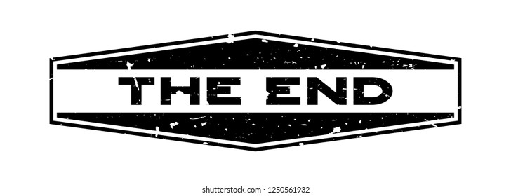 Grunge black the end word hexagon rubber seal stamp on white background