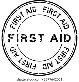 Grunge black first aid word round rubber seal stamp on white background