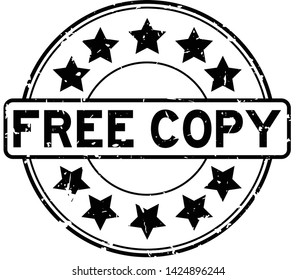 Grunge black free copy word with star icon round rubber seal stamp on white background