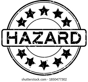 Grunge black hazard word round rubber seal stamp on white background