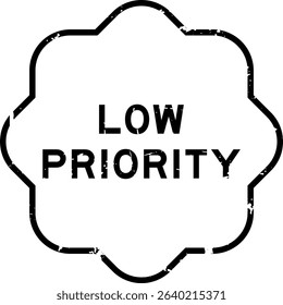 Grunge black low priority word rubber seal stamp on white background