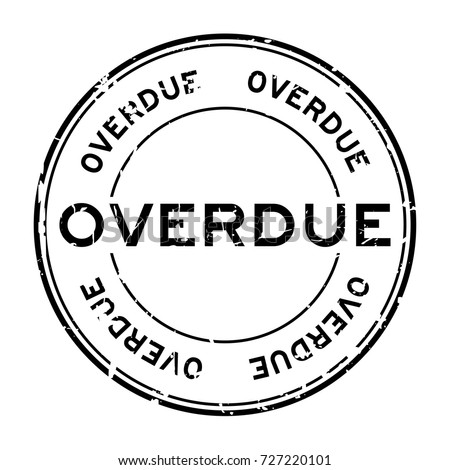 Grunge black overdue round rubber seal stamp on white background