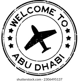 Grunge black welcome to abu dhabi with airplane icon round rubber seal stamp on white background