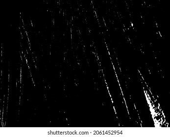 Grunge is black and white. Texture of black strokes on a white background. Abstract chaotic movements with a dry brush. Monochrome pattern of worn surface