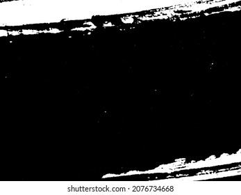 Grunge is black and white. Texture of black strokes on a white background. Abstract chaotic movements with a dry brush. Monochrome pattern of worn surface