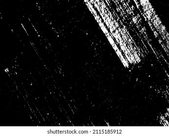 Grunge is black and white. Texture of black strokes on a white background. Abstract chaotic movements with a dry brush. Monochrome pattern of worn surface