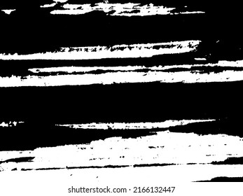 Grunge is black and white. Texture of black strokes on a white background. Abstract chaotic movements with a dry brush. Monochrome pattern of worn surface