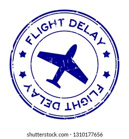 Grunge blue flight delay word with airplane icon round rubber seal stamp on white background