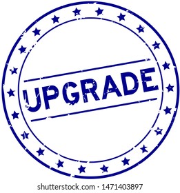Grunge blue upgrade word round rubber seal stamp on white background