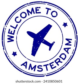 Grunge blue welcome to amsterdam with airplane icon round rubber seal stamp on white background