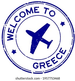 Grunge blue welcome to Greece word with airplane icon round rubber seal stamp on white background