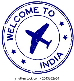 Grunge blue welcome to India word with airplane icon round rubber seal stamp on white background