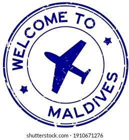 Grunge blue welcome to Maldives word with airplane icon round rubber seal stamp on white background