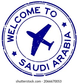 Grunge blue welcome to Saudi Arabia word with airplane icon round rubber seal stamp on white background