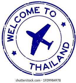 Grunge blue welcome to Thailand word with airplane icon round rubber seal stamp on white background