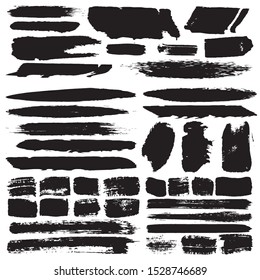 Grunge brush dry. Vector black spots on a white background