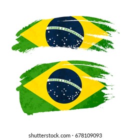 Grunge brush stroke with Brazil national flag isolated on white