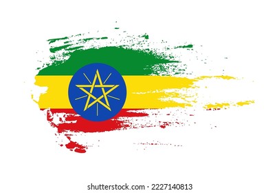 Grunge brush stroke flag of Ethiopia with painted brush splatter effect on solid background