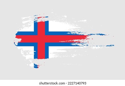 Grunge brush stroke flag of Faroe Islands with painted brush splatter effect on solid background