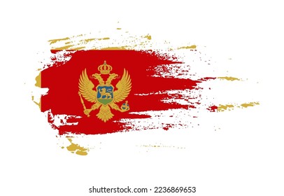 Grunge brush stroke flag of Montenegro with painted brush splatter effect on solid background