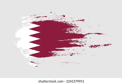 Grunge brush stroke flag of Qatar with painted brush splatter effect on solid background