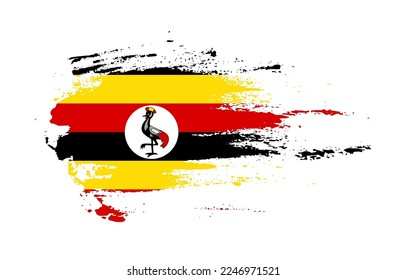 Grunge brush stroke flag of Uganda with painted brush splatter effect on solid background