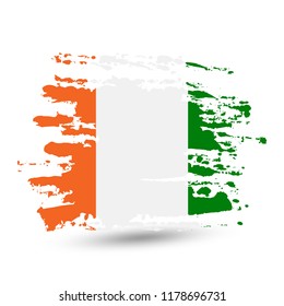 Grunge brush stroke with Ivory Coast national flag. Style watercolor drawing. Vector isolated on white background.