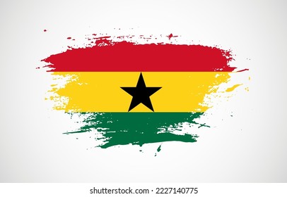Grunge brush stroke with the national flag of Ghana on a white isolated background