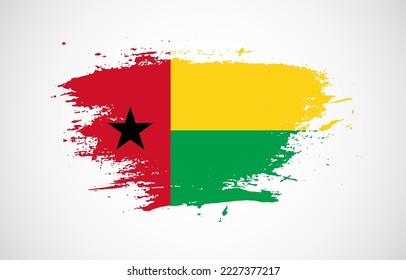 Grunge brush stroke with the national flag of Guinea-Bissau on a white isolated background