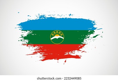 Grunge brush stroke with the national flag of Karachay-Cherkessia on a white isolated background