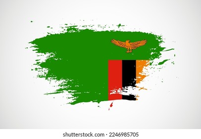 Grunge brush stroke with the national flag of Zambia on a white isolated background