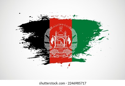 Grunge brush stroke with the national flag of Afghanistan on a white isolated background