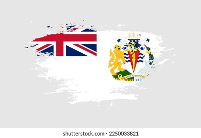 Grunge brush stroke with the national flag of British Antarctic Territory on a white isolated background