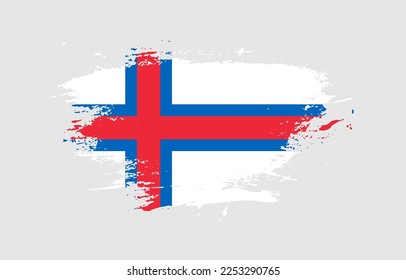 Grunge brush stroke with the national flag of Faroe Islands on a white isolated background