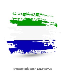 Grunge brush stroke with Sierra Leone national flag. Style watercolor drawing. Vector isolated on white background.