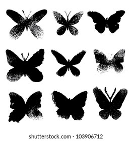 Grunge butterflies silhouettes on white background. Vector set