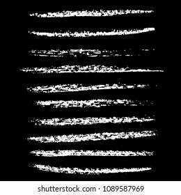 Grunge chalk strokes. Freehand black brushes. Handdrawn chalked smears. Modern vector illustration.