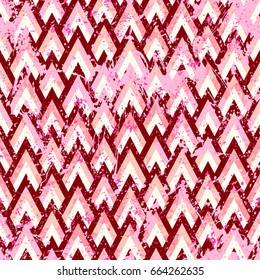 Grunge chevron vector pattern on splashed and splattered watercolor painted background. Bold zigzag print with retro motif in vintage boho chic style. Modern geometric texture in pink colors