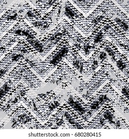 Grunge chevron vector pattern on watercolor paint splashed and splattered. Bold zigzag print with ethnic tribal and retro motif in vintage boho chic style. Modern hand drawn texture in black and white