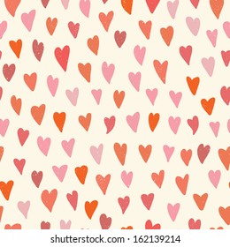 Grunge colorful hearts seamless pattern on beige background